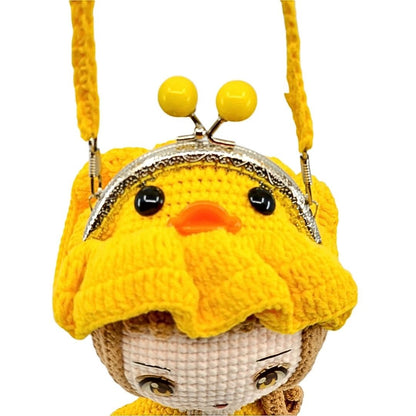 Yellow knitted purse with a duck character face on a white background