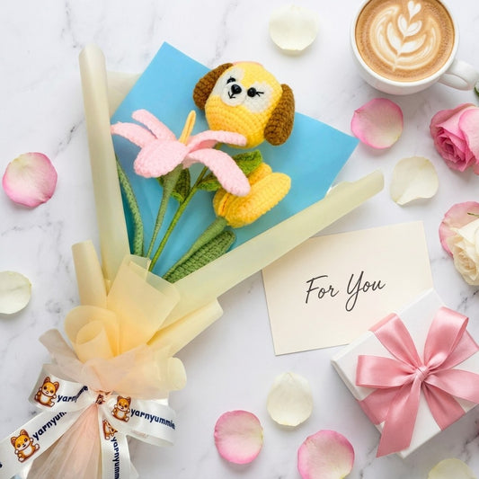 Cup of coffee with a plush toy, flowers, and gift on a marble surface