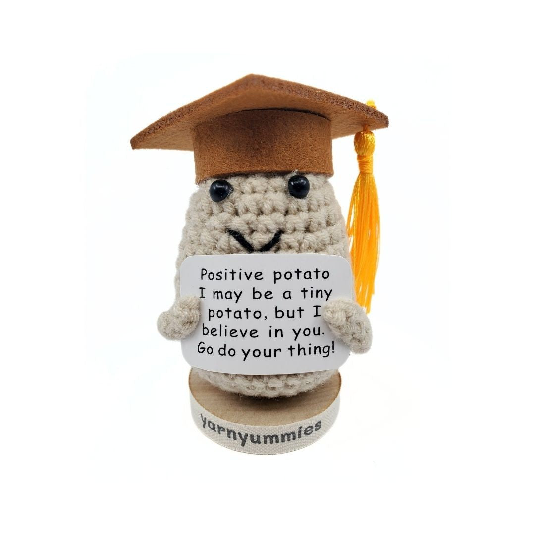 Graduation-themed potato plush with a message on a white background