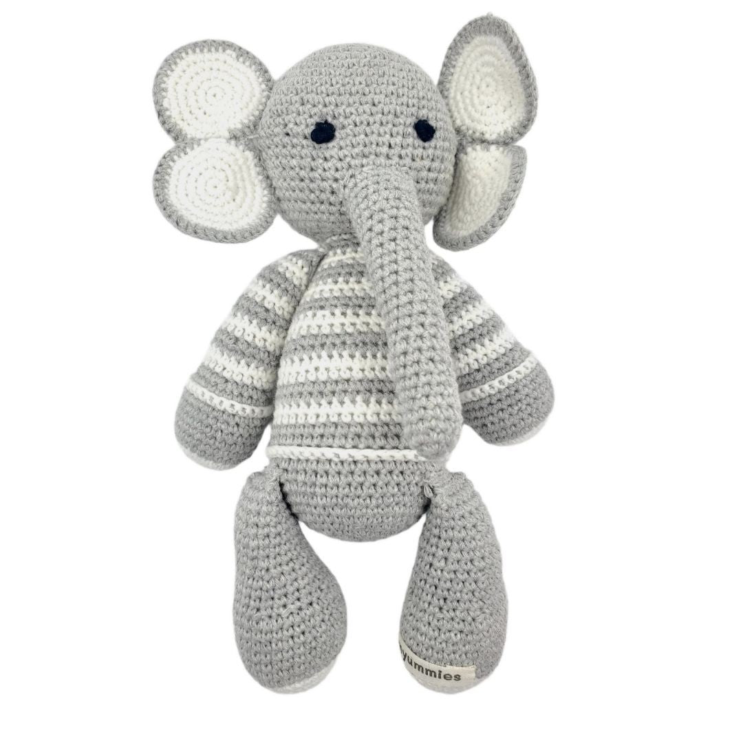 Crocheted elephant toy with a striped pattern on a white background