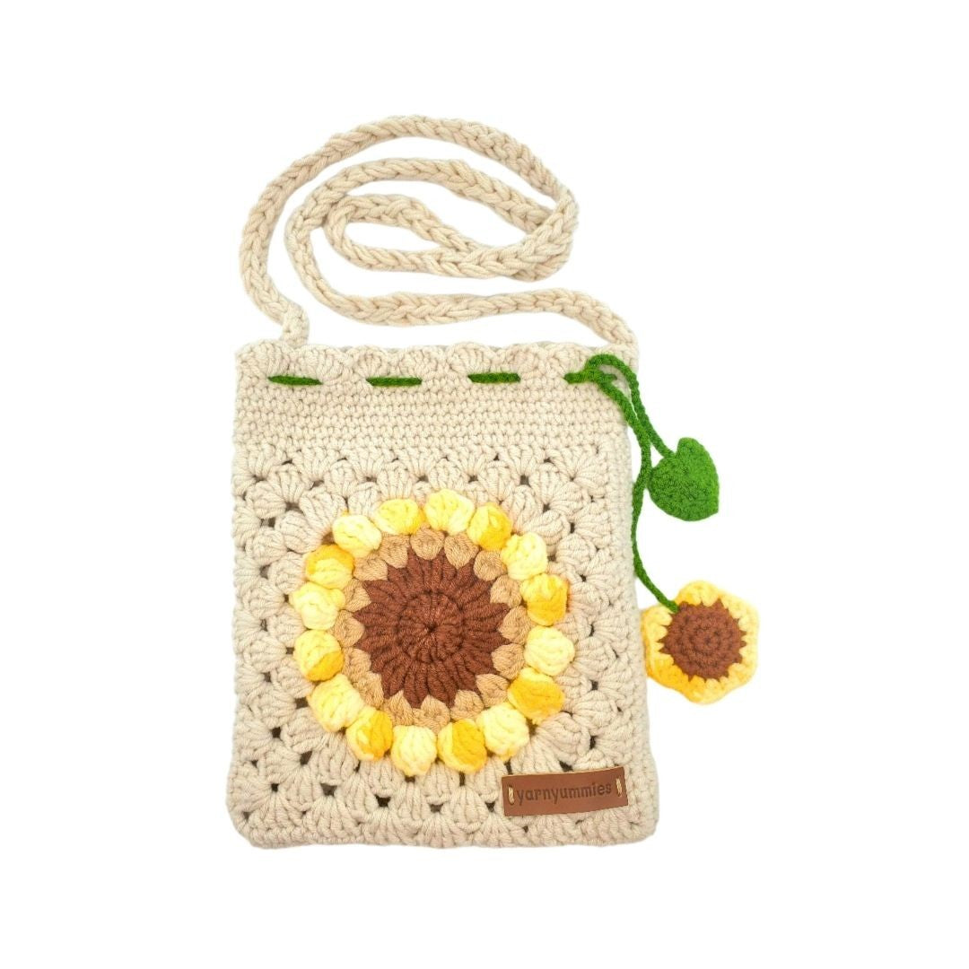 Beige Crocheted sunflower bag with a strap on a white background