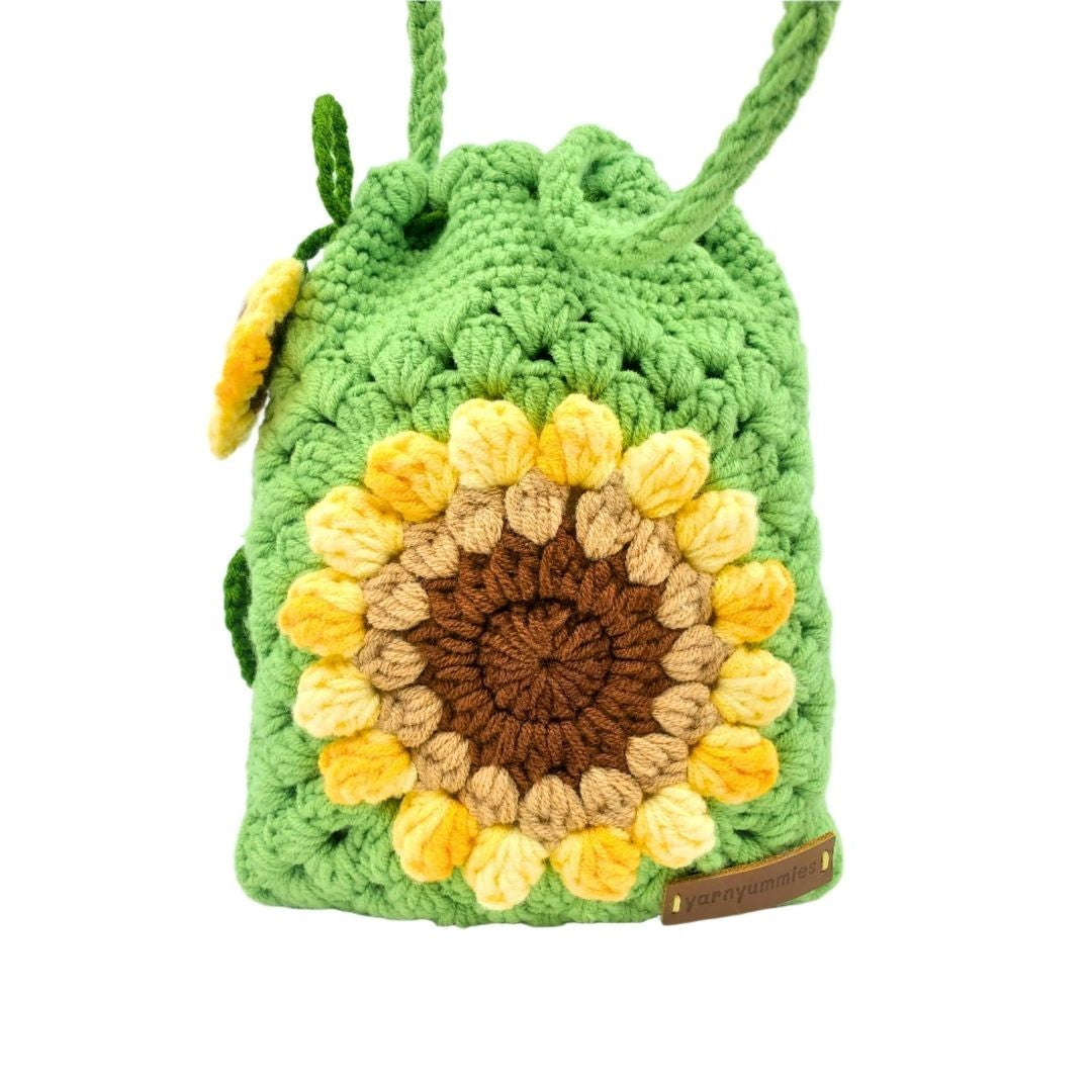 Crocheted bag with sunflower design on a white background
