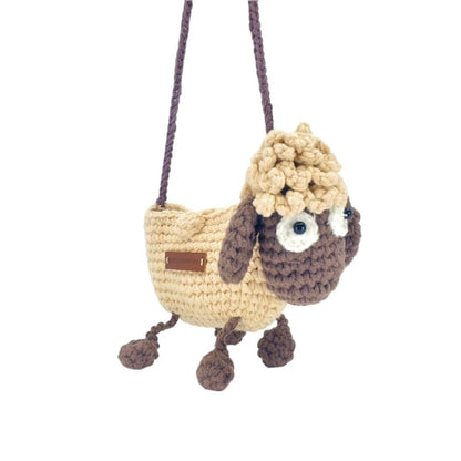 Crocheted lamb-shaped bag with a fluffy head on a white background
