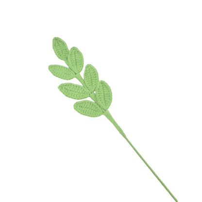 Artificial green leaf stem on a white background