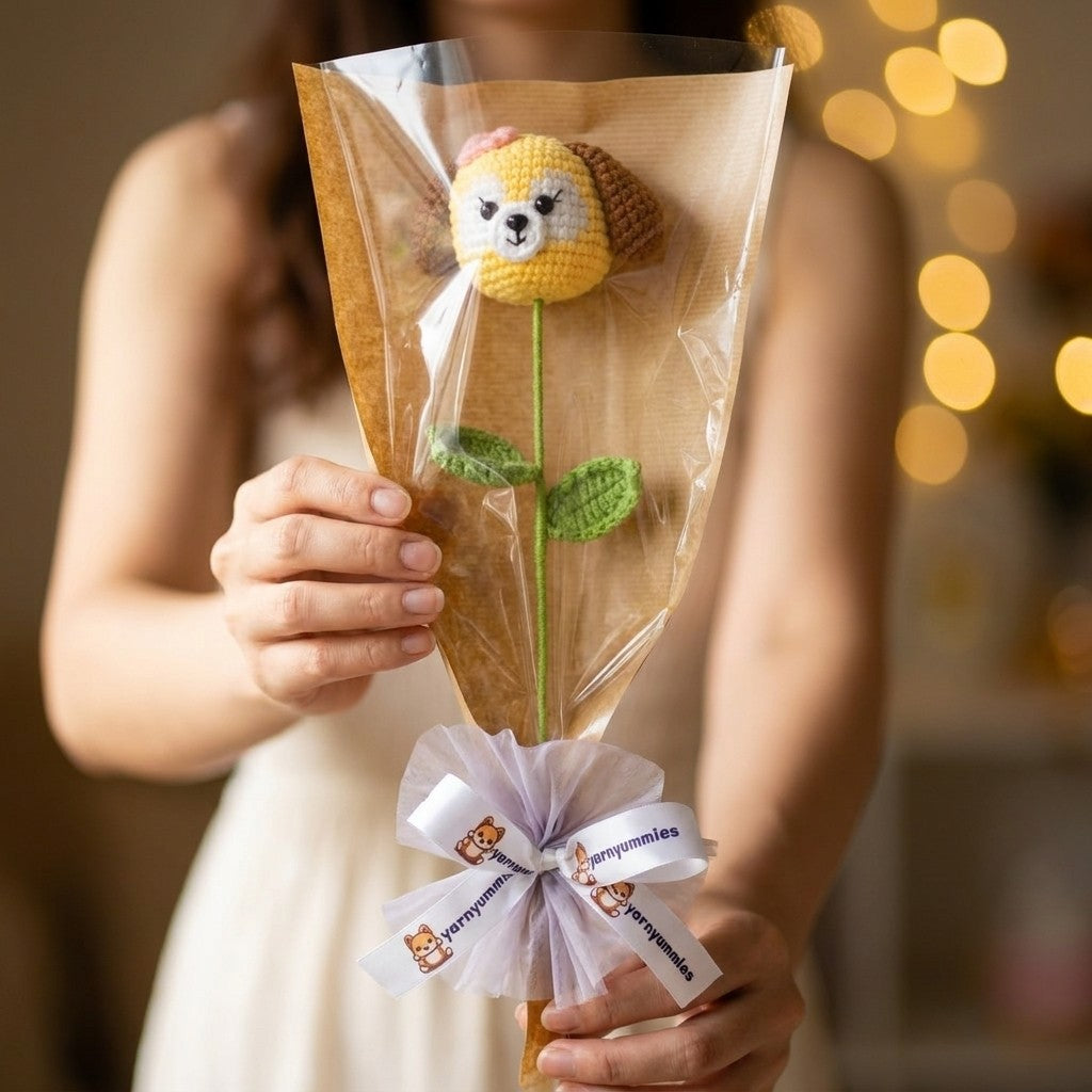 Person holding a bouquet of puppy head shaped like a flower with a blurred background.