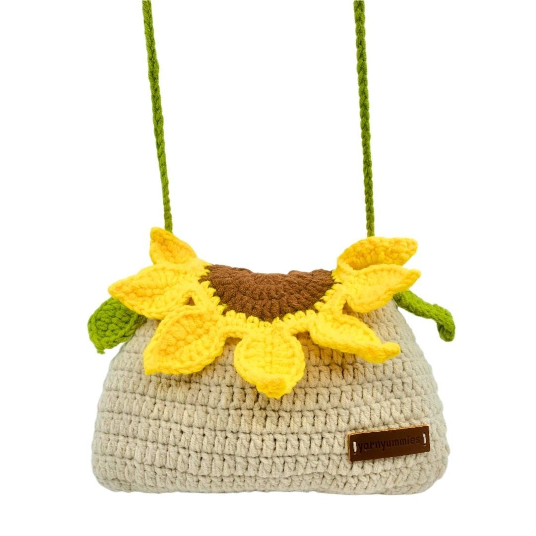 Crocheted handbag with sunflower design on a white background