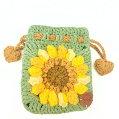 Crocheted pouch with sunflower design on a white background