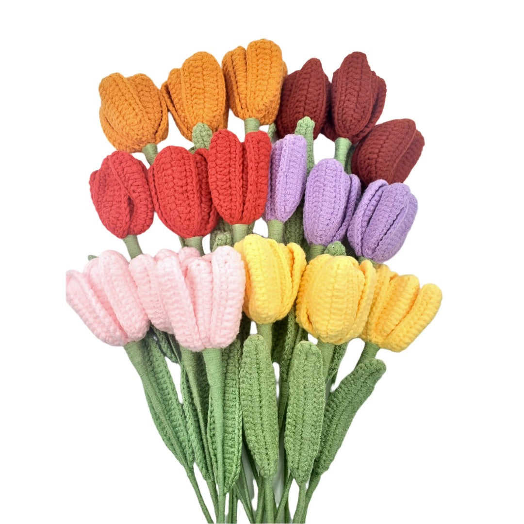 Colorful crocheted tulips on a white background