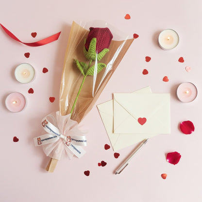 Bouquet of flowers with candles and cards on a pink background
